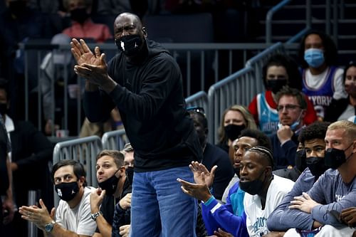 MJ cheering on his Charlotte Hornets from courtside