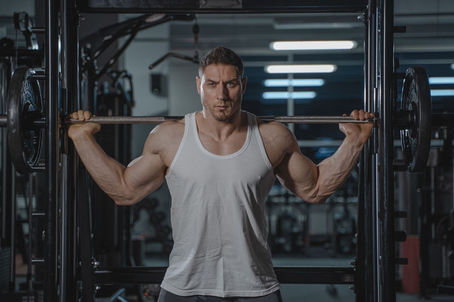 A barbell shoulder press is a compound exercise targeting several muscles in the body. (Photo by Tima Miroshnichenko via pexels)