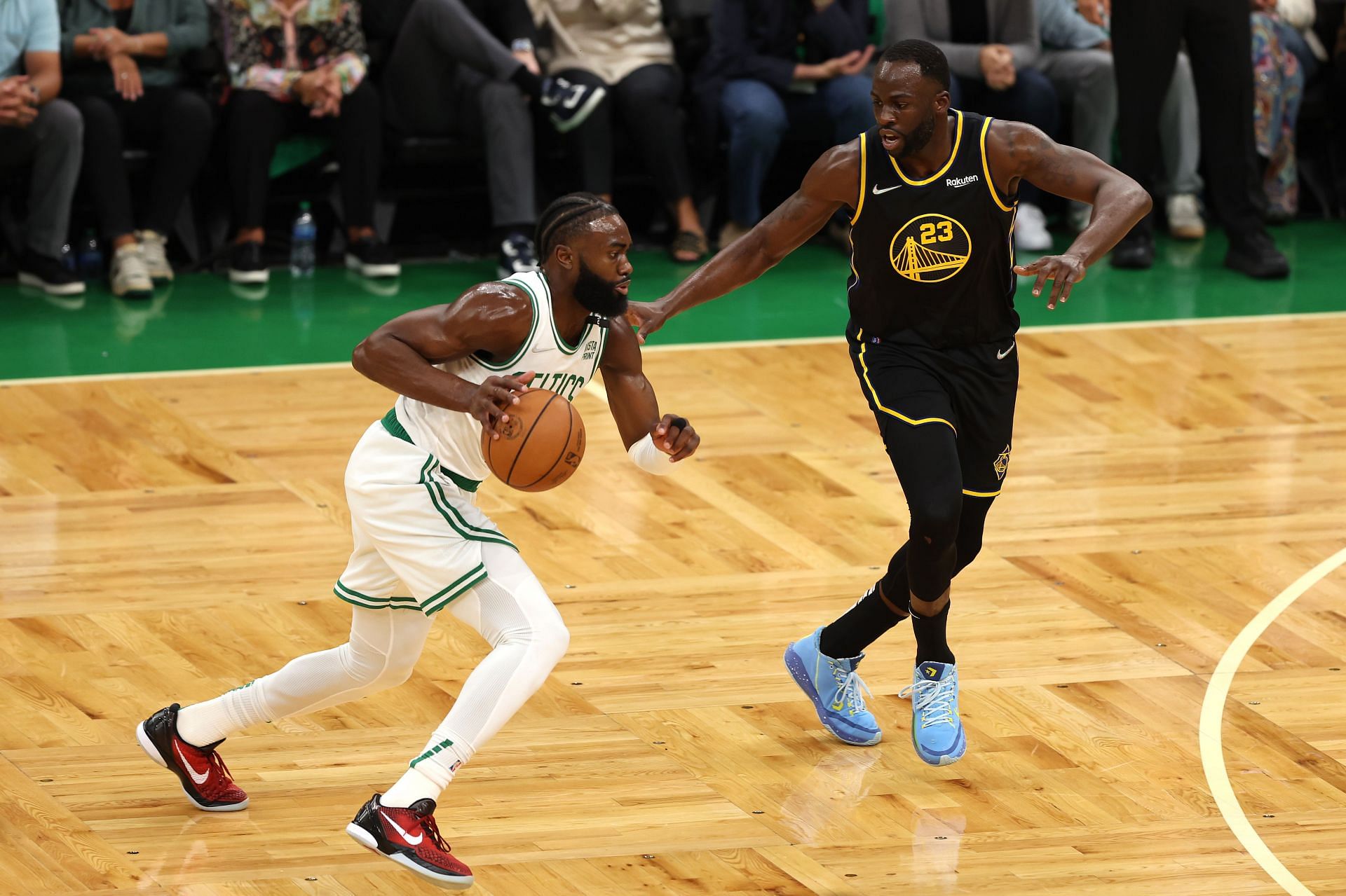 Jaylen Brown #7 of the Boston Celtics drives to the basket defended by Draymond Green #23 of the Golden State Warriors