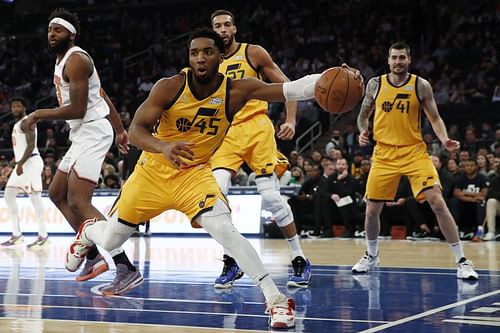 Donovan Mitchell saves a ball from going out of bounds