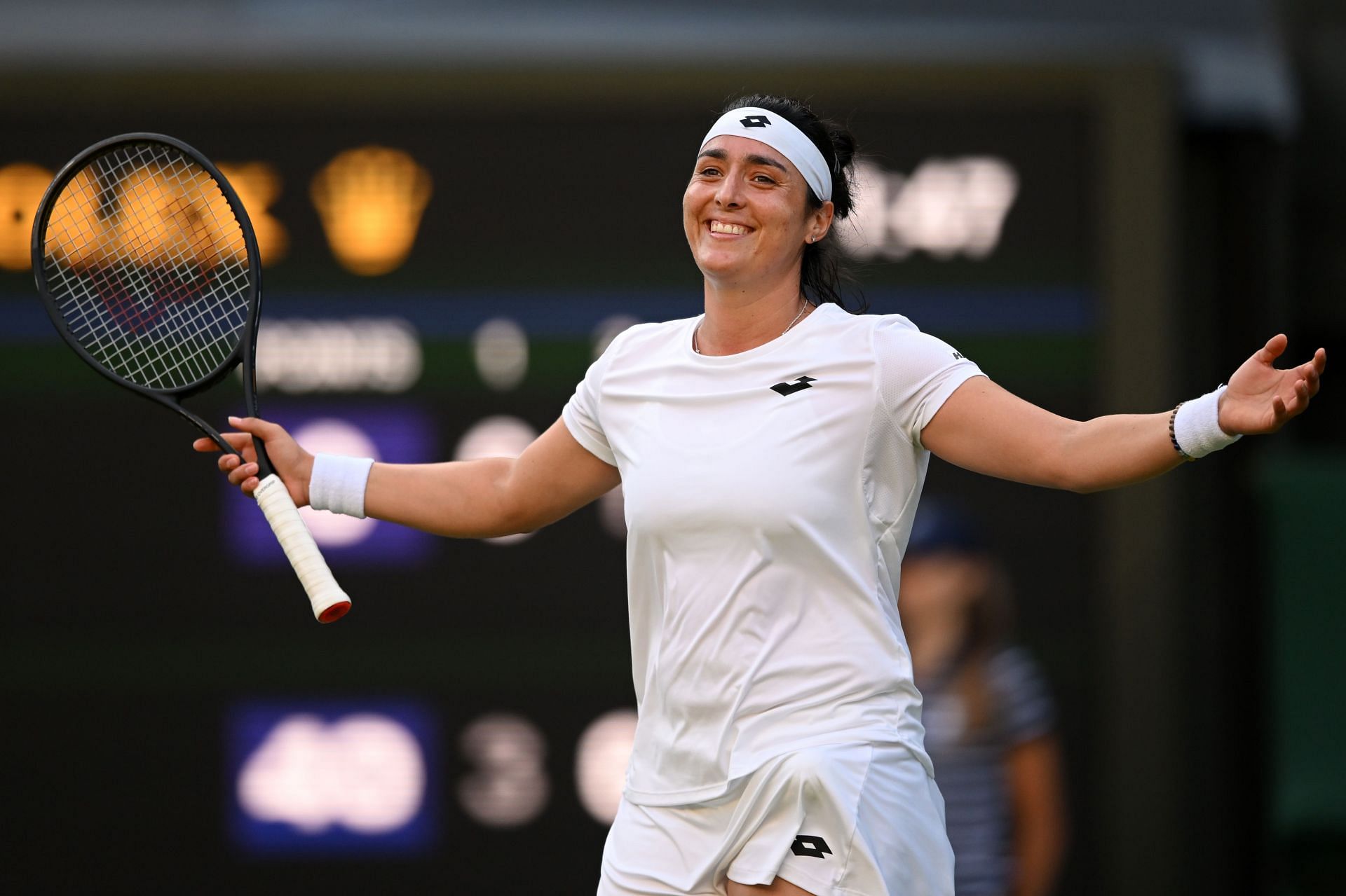 Ons Jabeur is all smiles after winning her quarterfinal skirmish against Marie Bouzkova at Wimbledon