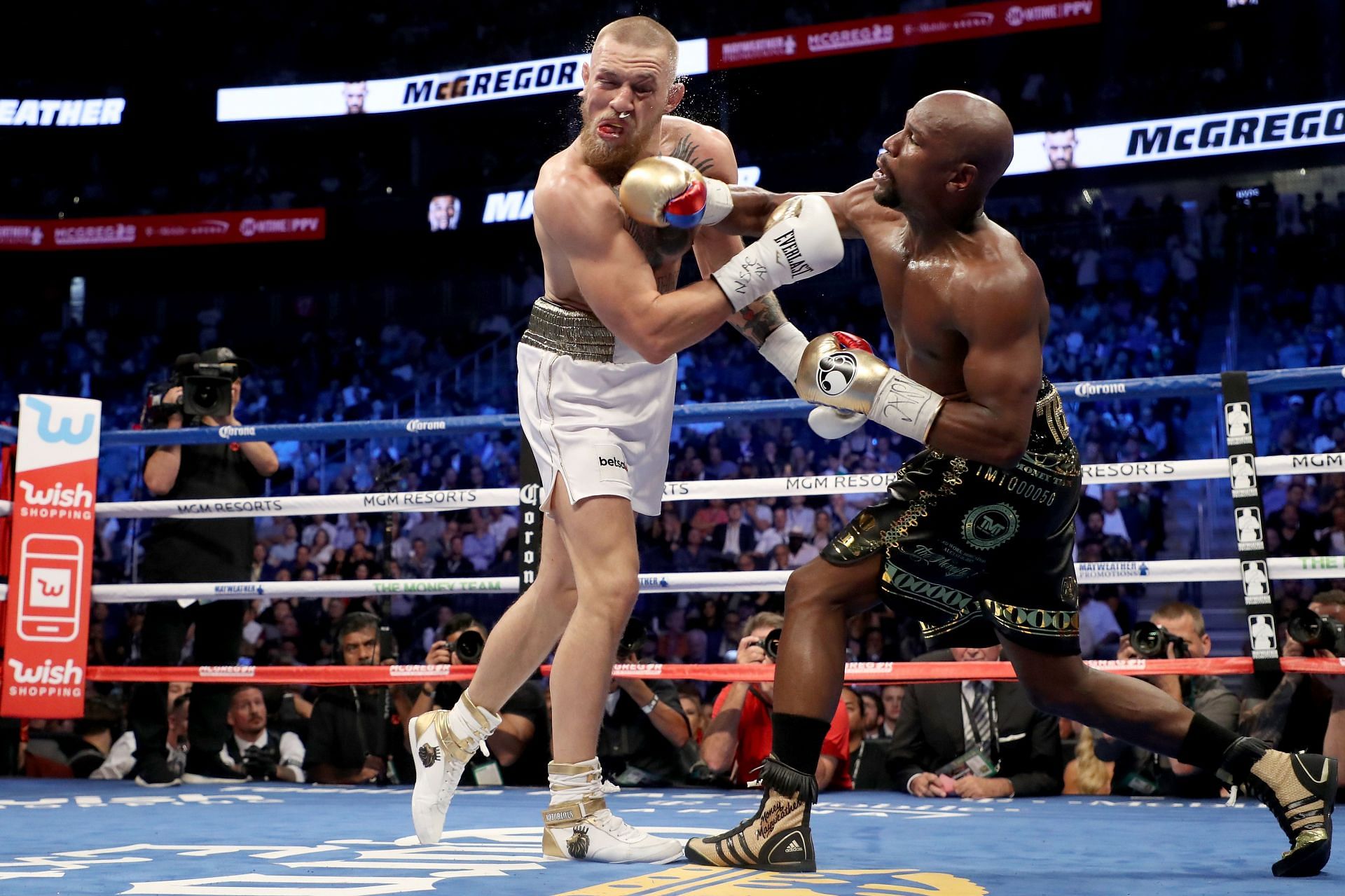 Conor McGregor (L) vs. Floyd Mayweather Jr. (R) back in 2017