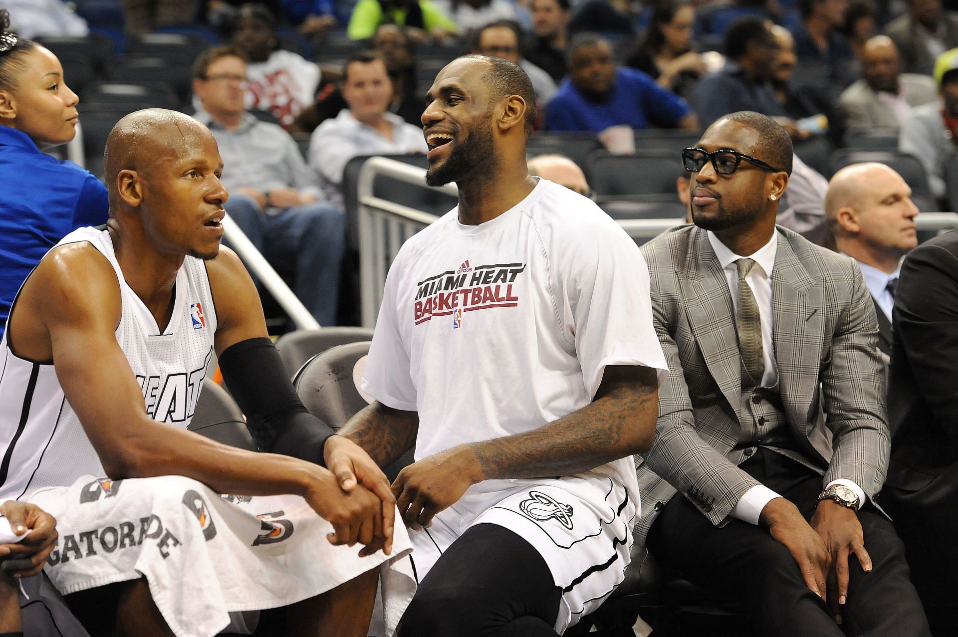 Ray Allen, LeBron James and Dwyane Wade watch on from the sidelines during the Miami Heat v Orlando Magic game