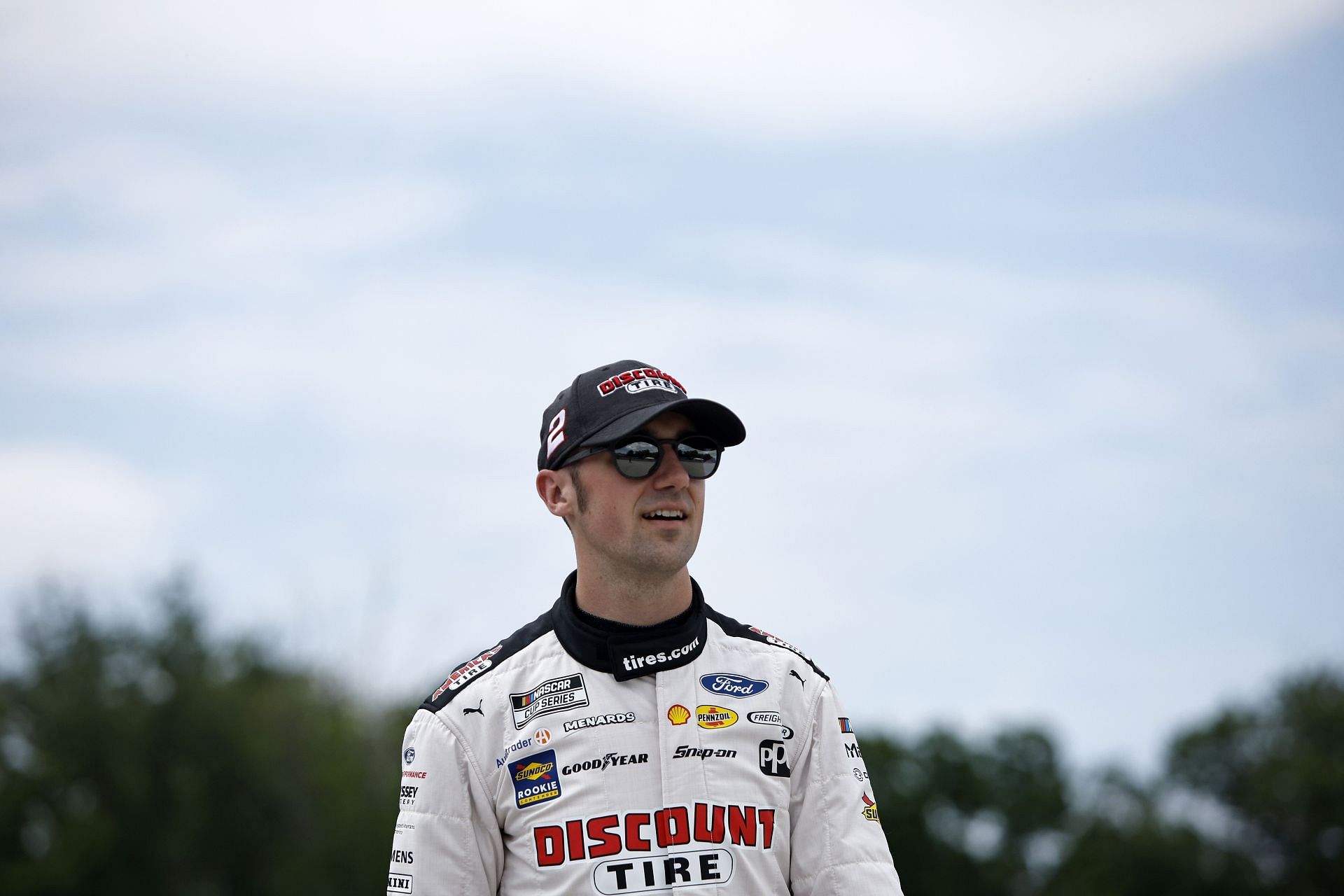 Austin Cindric walks the grid prior to the NASCAR Cup Series Kwik Trip 250 at Road America