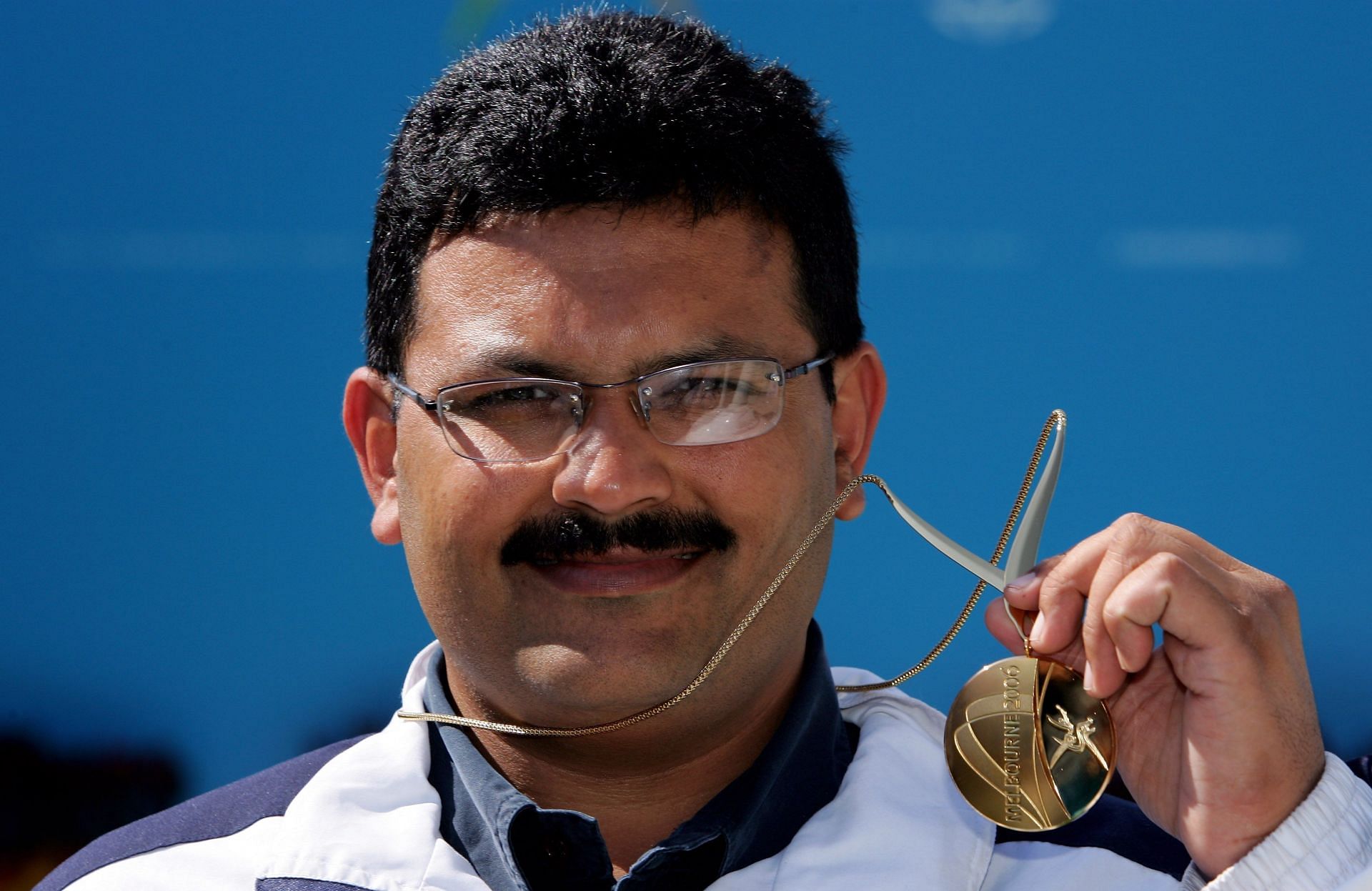 Samaresh Jung poses after winning the gold medal in the Men&#039;s 50m pistol final at the 2006 Commonwealth Games.