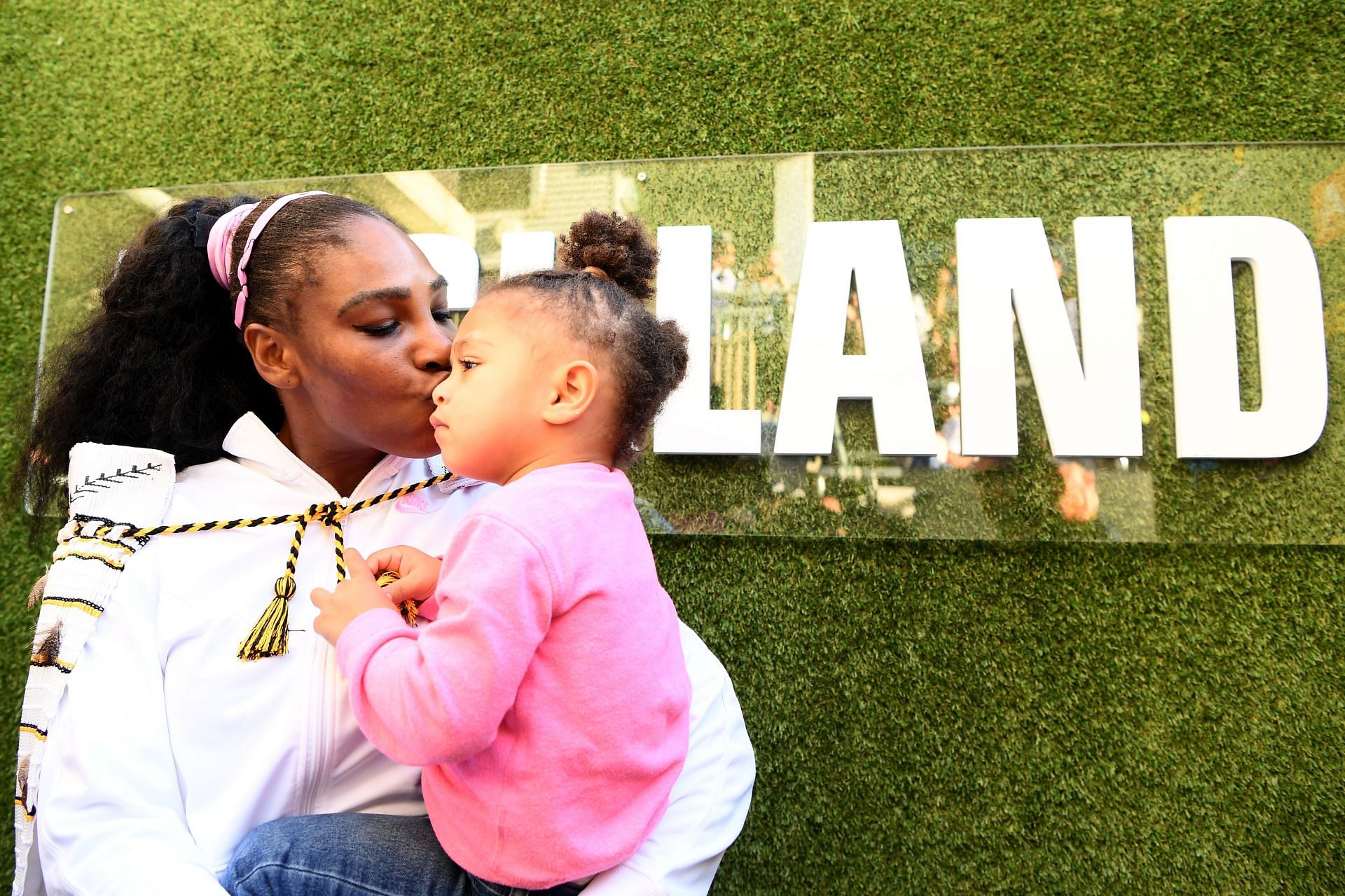 Serena Williams kisses daughter Olympia Ohanian as she wins her 73rd title and first since coming back from maternity leave in Auckland 2020.