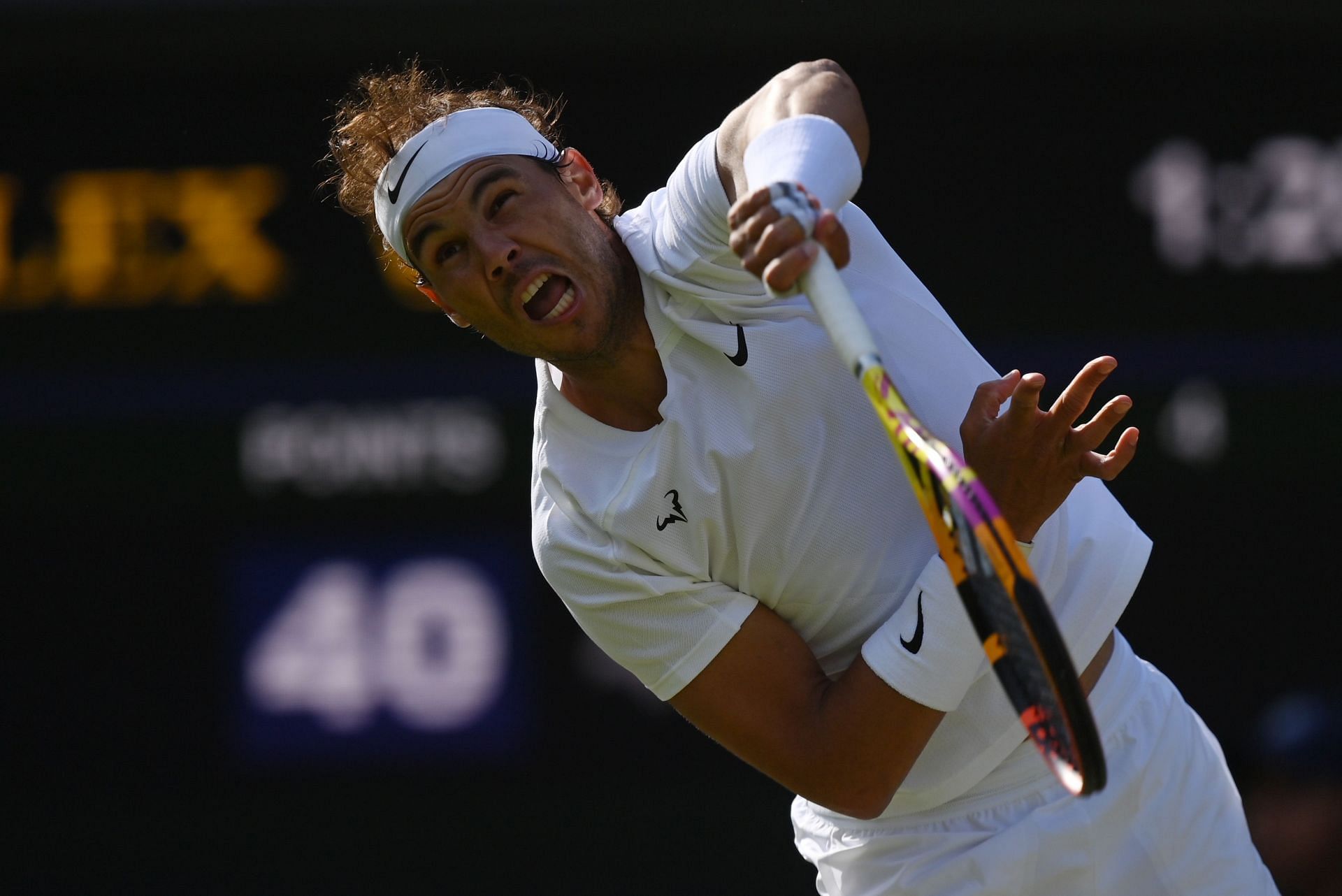 Rafael Nadal serves at the 2022 Wimbledon Championships