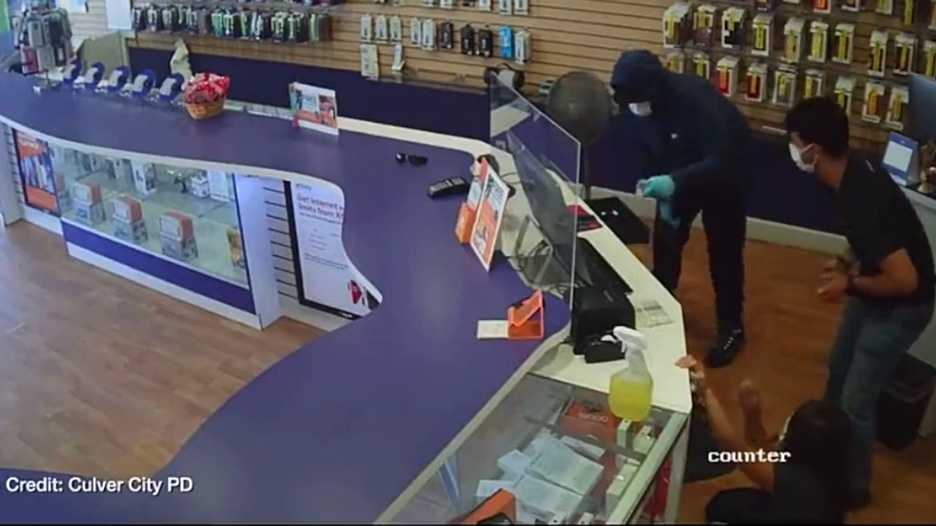 The brazen robbery at Boost Mobile was captured on camera. (Image via Culver City Police Department)
