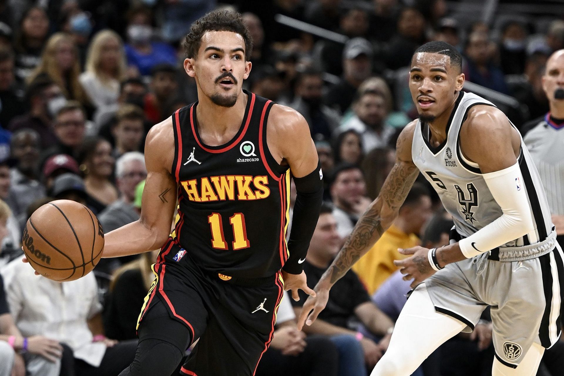 Trae Young, left, and Dejounte Murray, right