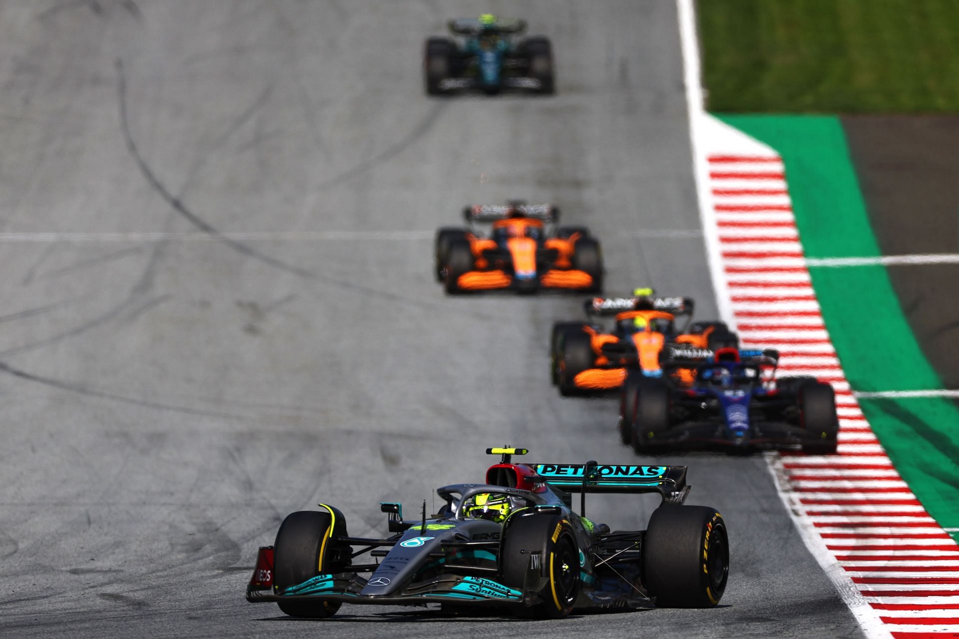 2022 F1 Grand Prix of Austria - Sprint - Lewis Hamilton leads a group of cars in Austria