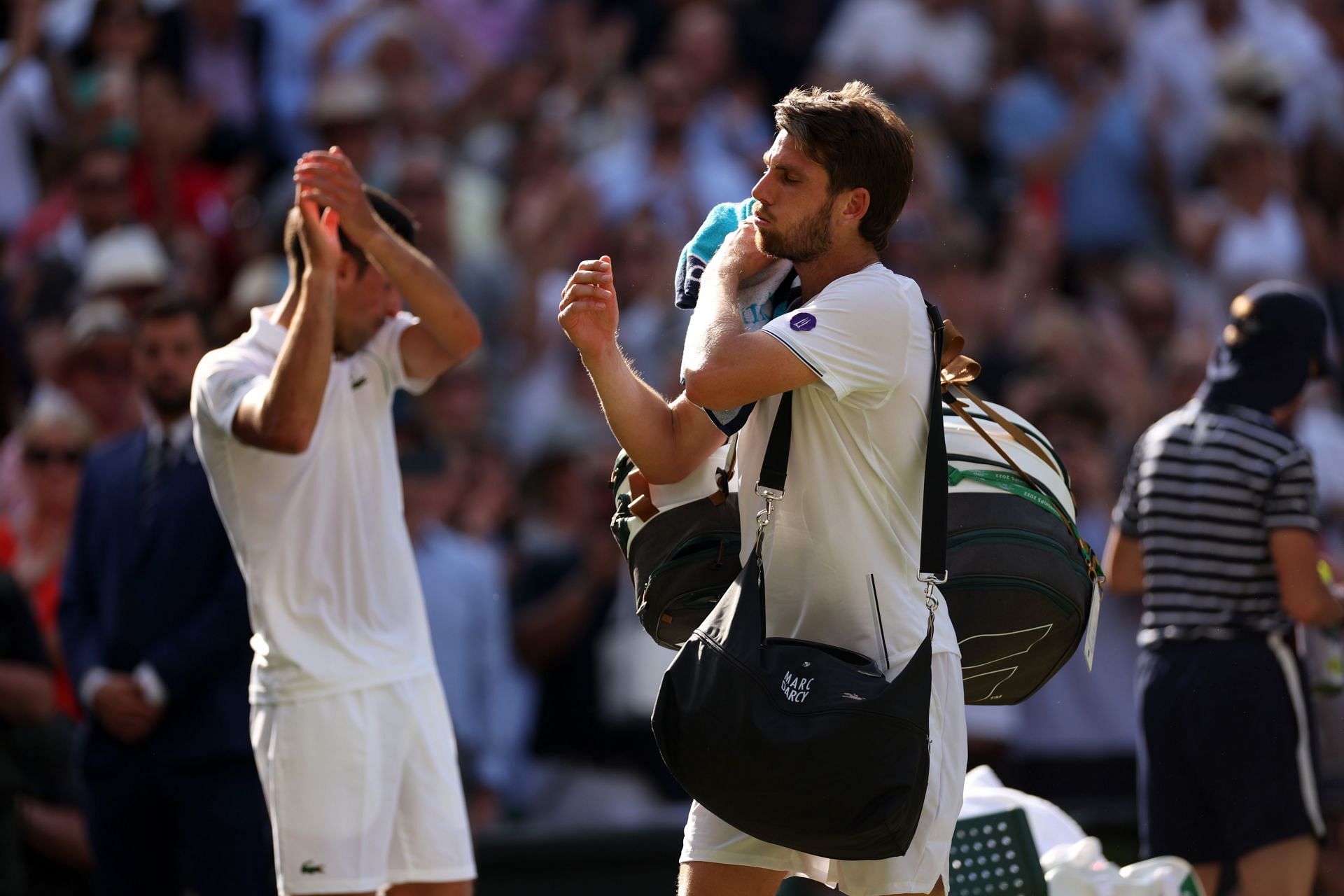Novak Djokovic applauds as Cameron Norrie leaves the court after their semifinal clash at Wimbledon 2022