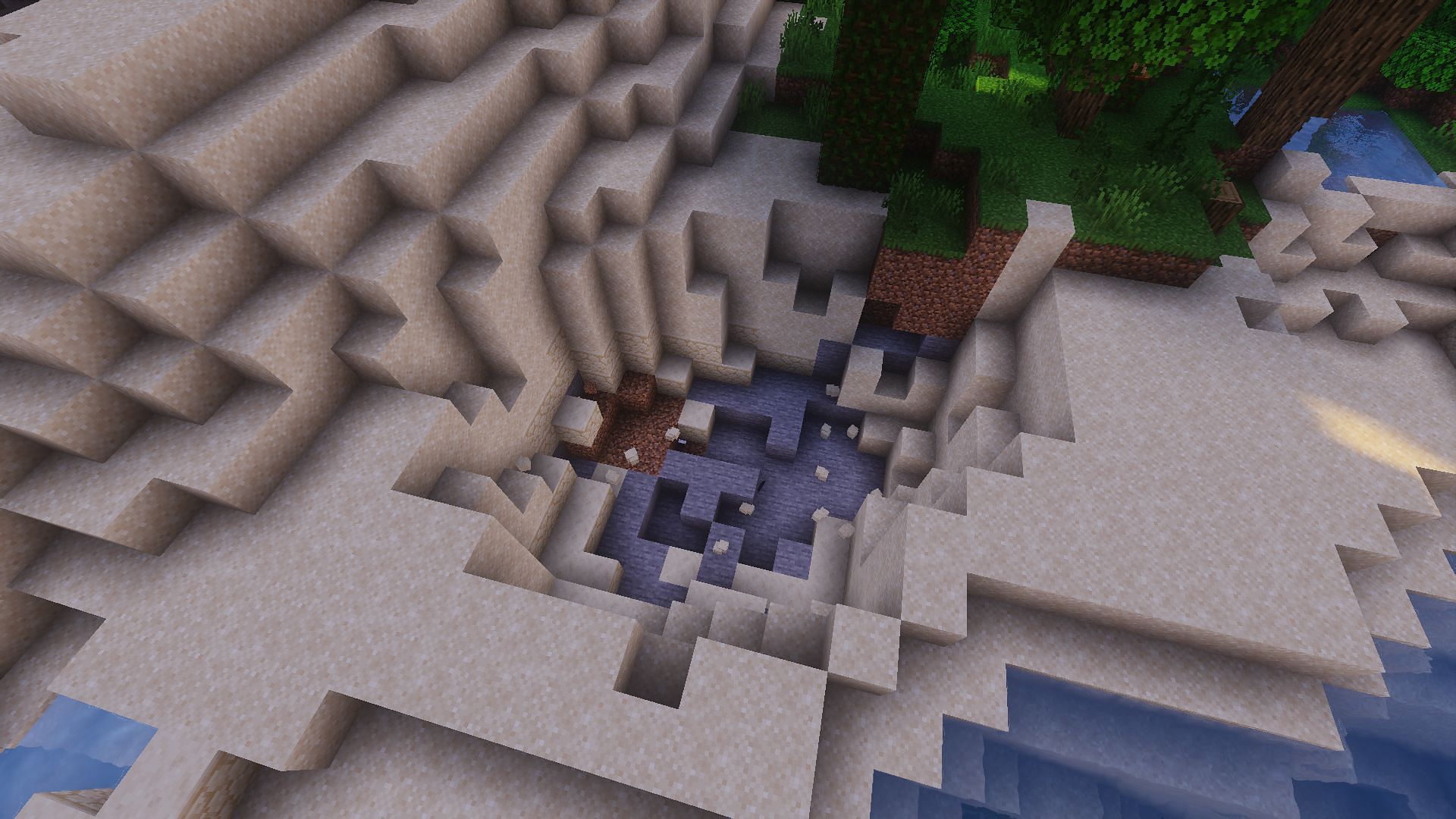 The whole in the ground resulting from a four TNT bed trap (Image via Minecraft)