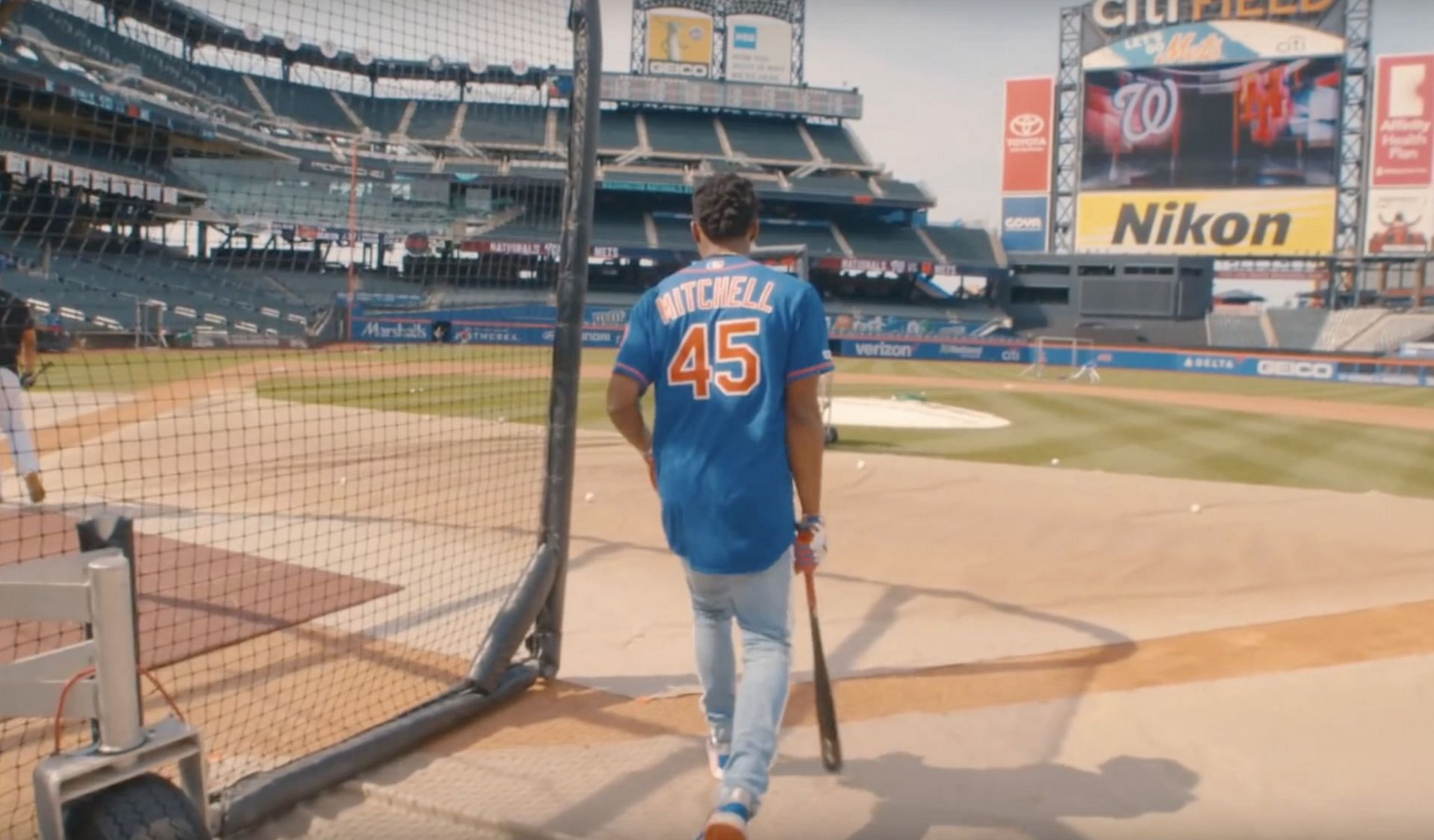 Donovan Mitchell tries batting practice at Citi Field. (Image from the Utah Jazz via Deseret News)