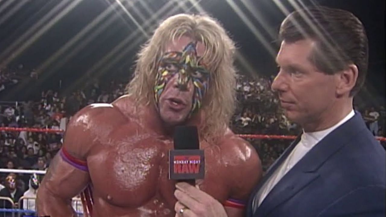 The Ultimate Warrior standing next to Vince McMahon