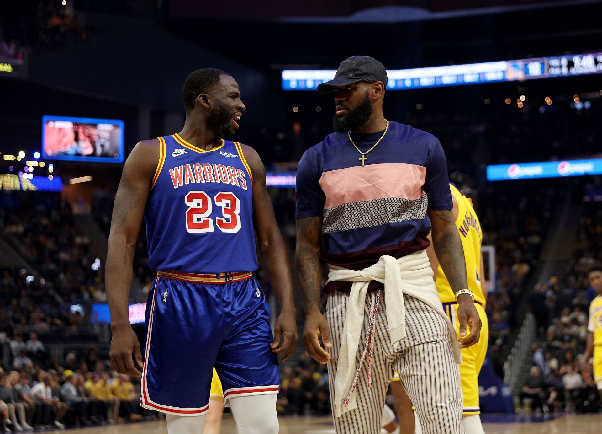 Draymond Green of the Golden State Warriors talks with LeBron James of the LA Lakers