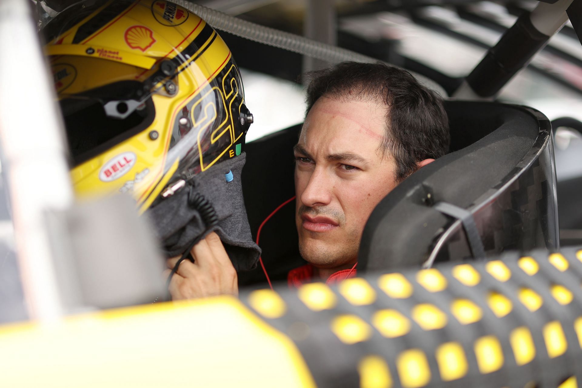 Joey Logano sits in his car during qualifying for the 2022 NASCAR Cup Series Ambetter 301 at New Hampshire Motor Speedway in Loudon, New Hampshire. (Photo by James Gilbert/Getty Images)