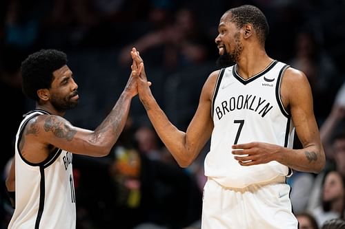 Kevin Durant and Kyrie Irving celebrate a play