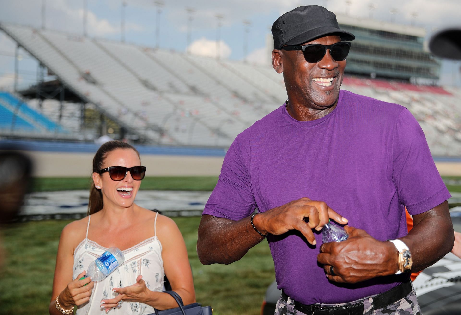 NBA Hall of Famer Michael Jordan and co-owner of 23XI Racing walks the grid with his wife, Yvette Prieto during qualifying for the NASCAR Cup Series Ally 400 at Nashville Superspeedway on June 25, 2022 in Lebanon, Tennessee.