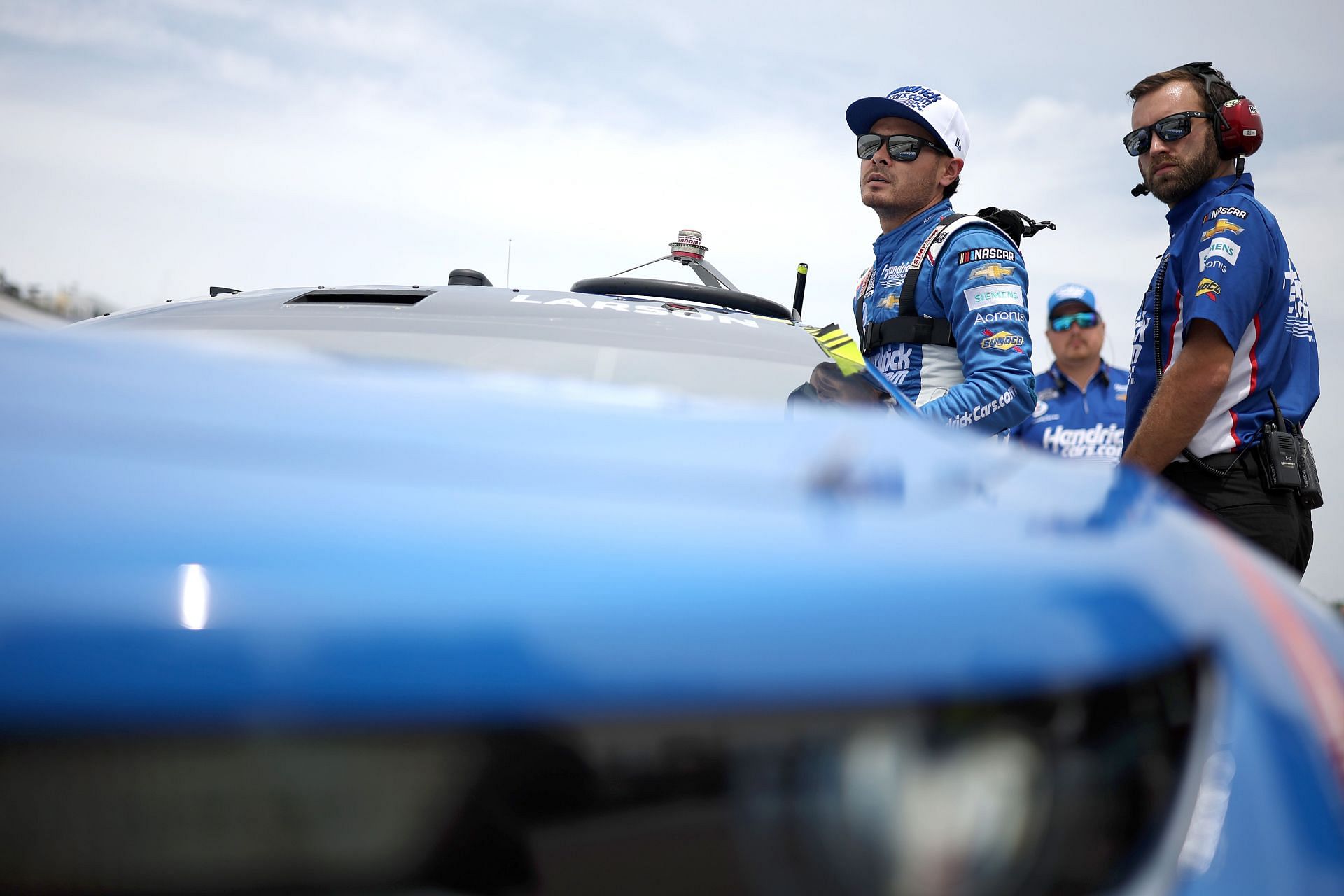 Kyle Larson enters his car during qualifying for the 2022 NASCAR Cup Series Ambetter 301 at New Hampshire Motor Speedway in Loudon, New Hampshire. (Photo by James Gilbert/Getty Images)
