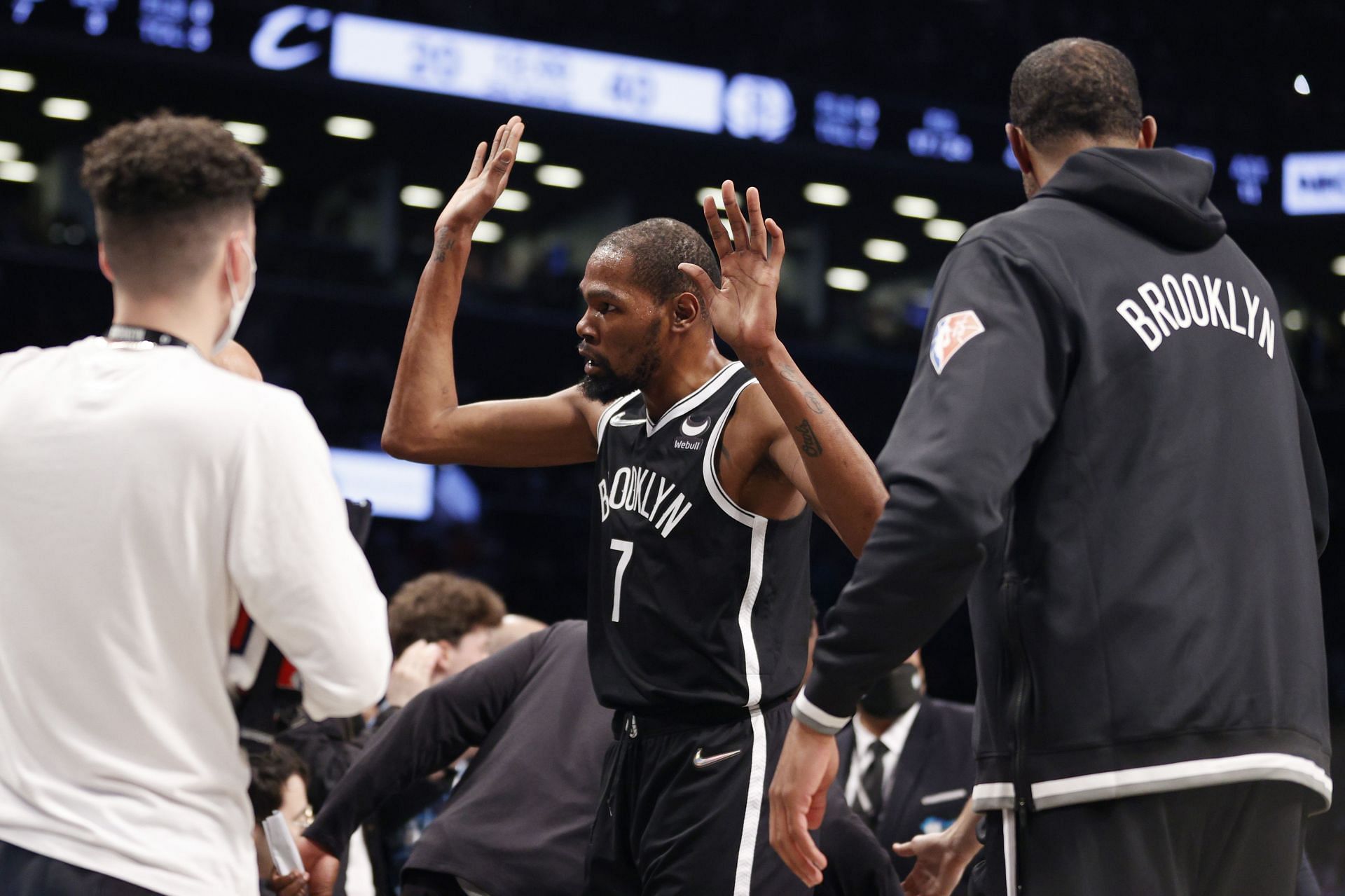 Kevin Durant #7 of the Brooklyn Nets high-fives teammates