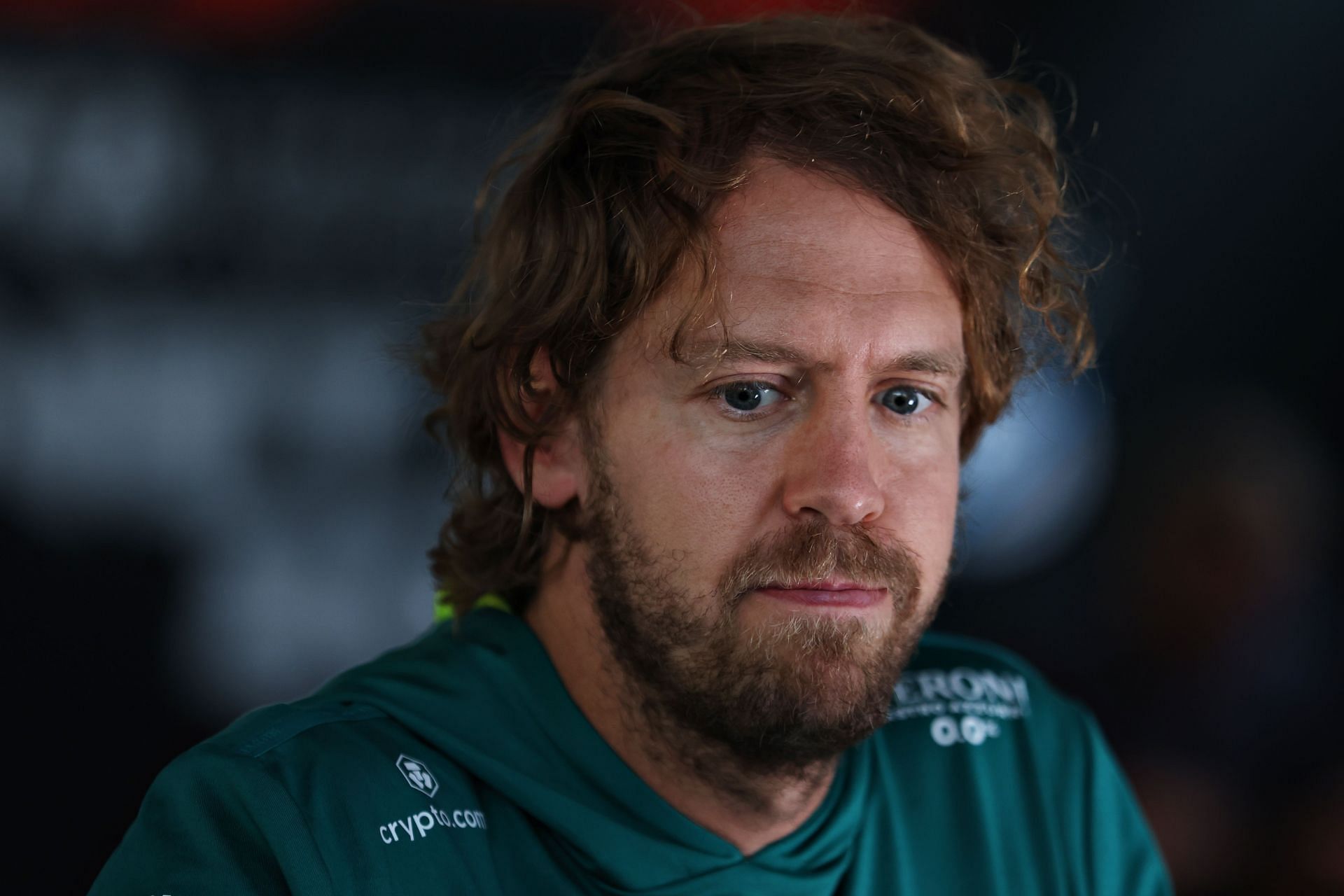 Aston Martin driver Sebastian Vettel speaks to the media during the 2022 F1 Austrian GP weekend (Photo by Bryn Lennon/Getty Images)