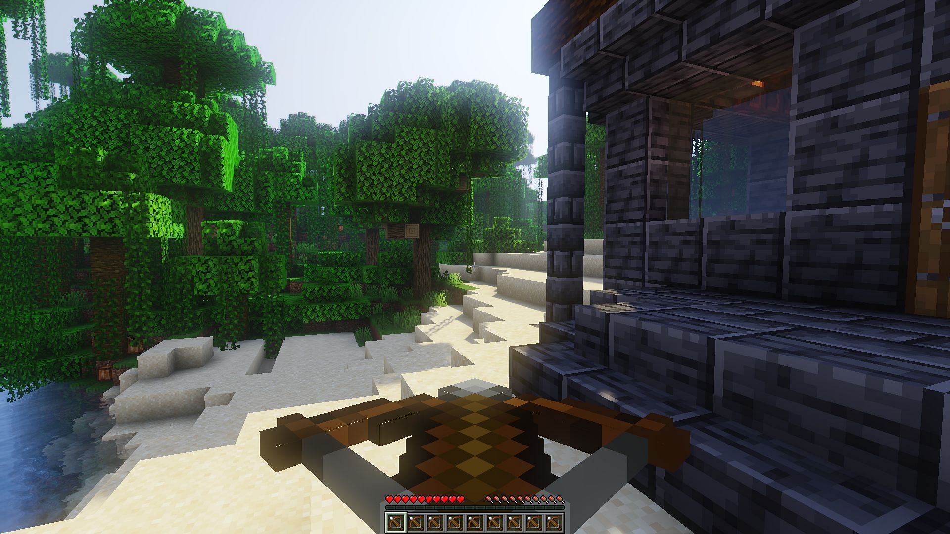 A gamer with a hotbar filled with loaded crossbows (Image via Minecraft)