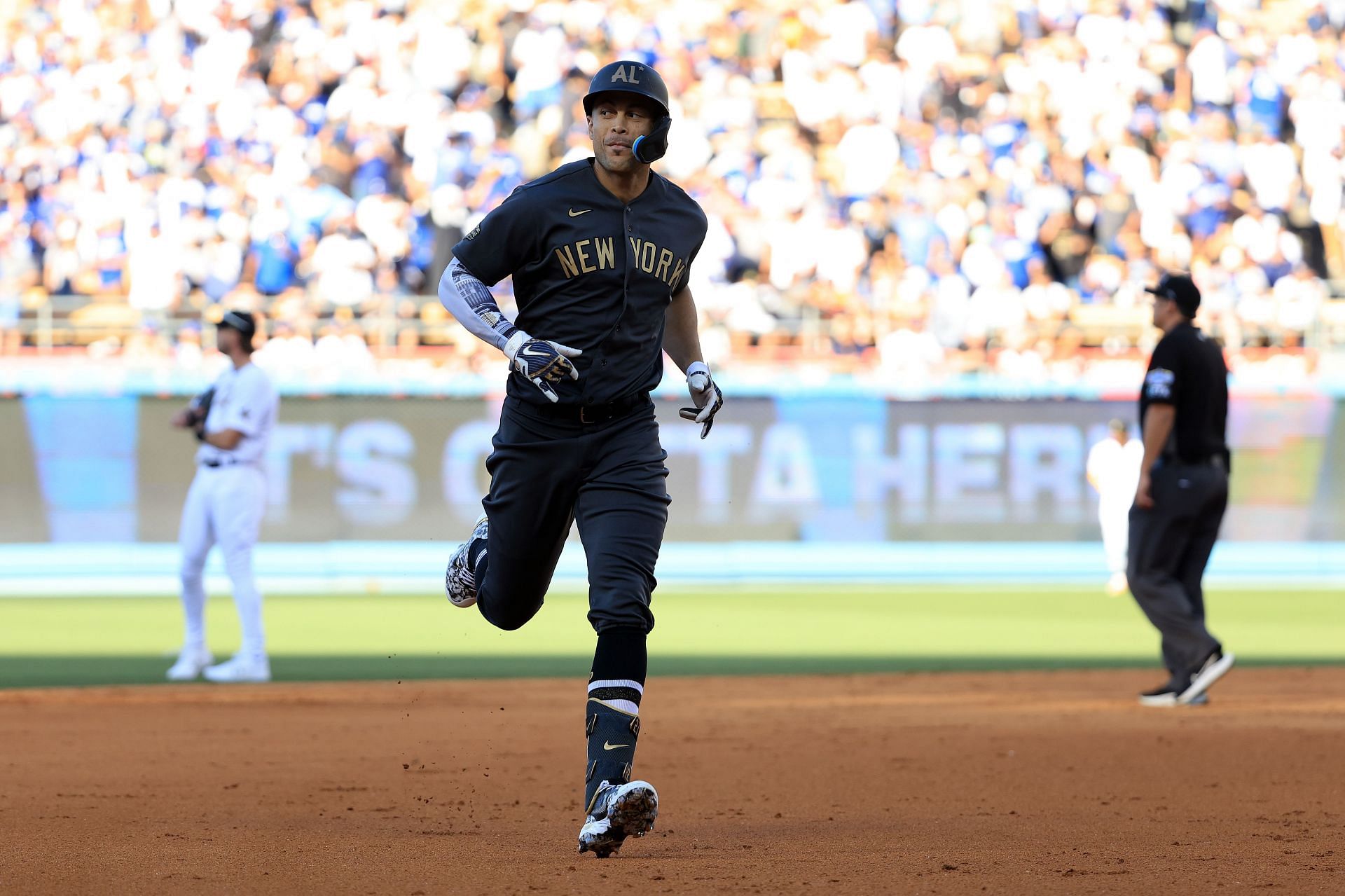 New York Yankees' Giancarlo Stanton rounds the bases after hitting