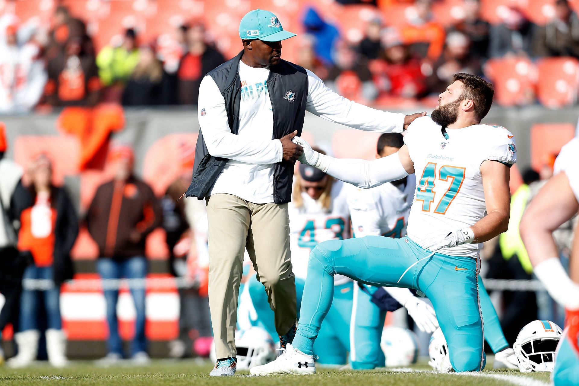 Brian Flores working with a player