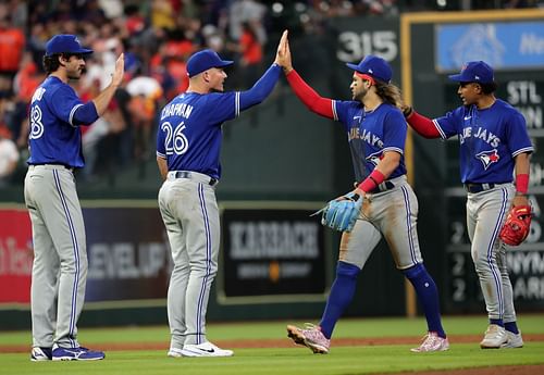 Matt Chapman and Bo Bichette of the Toronto Blue Jays celebrate a win versus the Houston Astros.