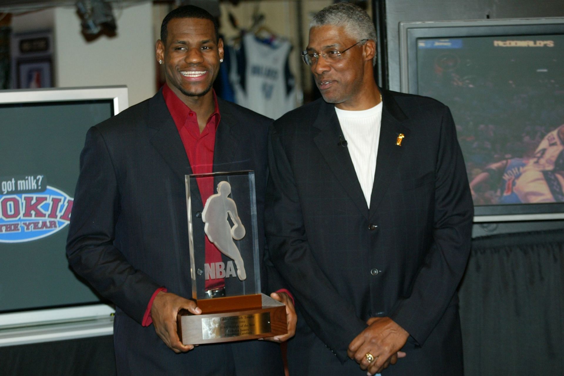 LeBron James, left, standing next to Julius &quot;Dr. J&quot; Erving