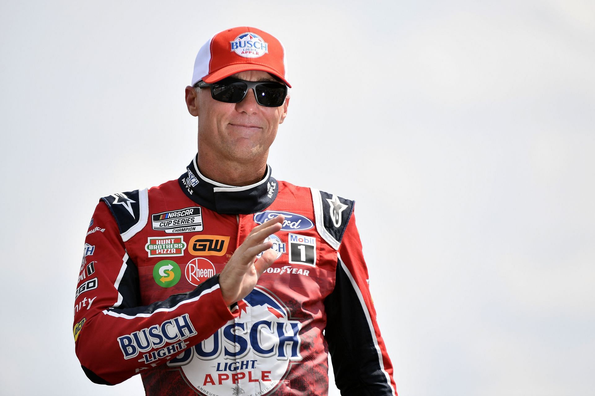 Kevin Harvick waves to fans onstage during driver intros before the NASCAR Cup Series Ally 400 at Nashville Superspeedway