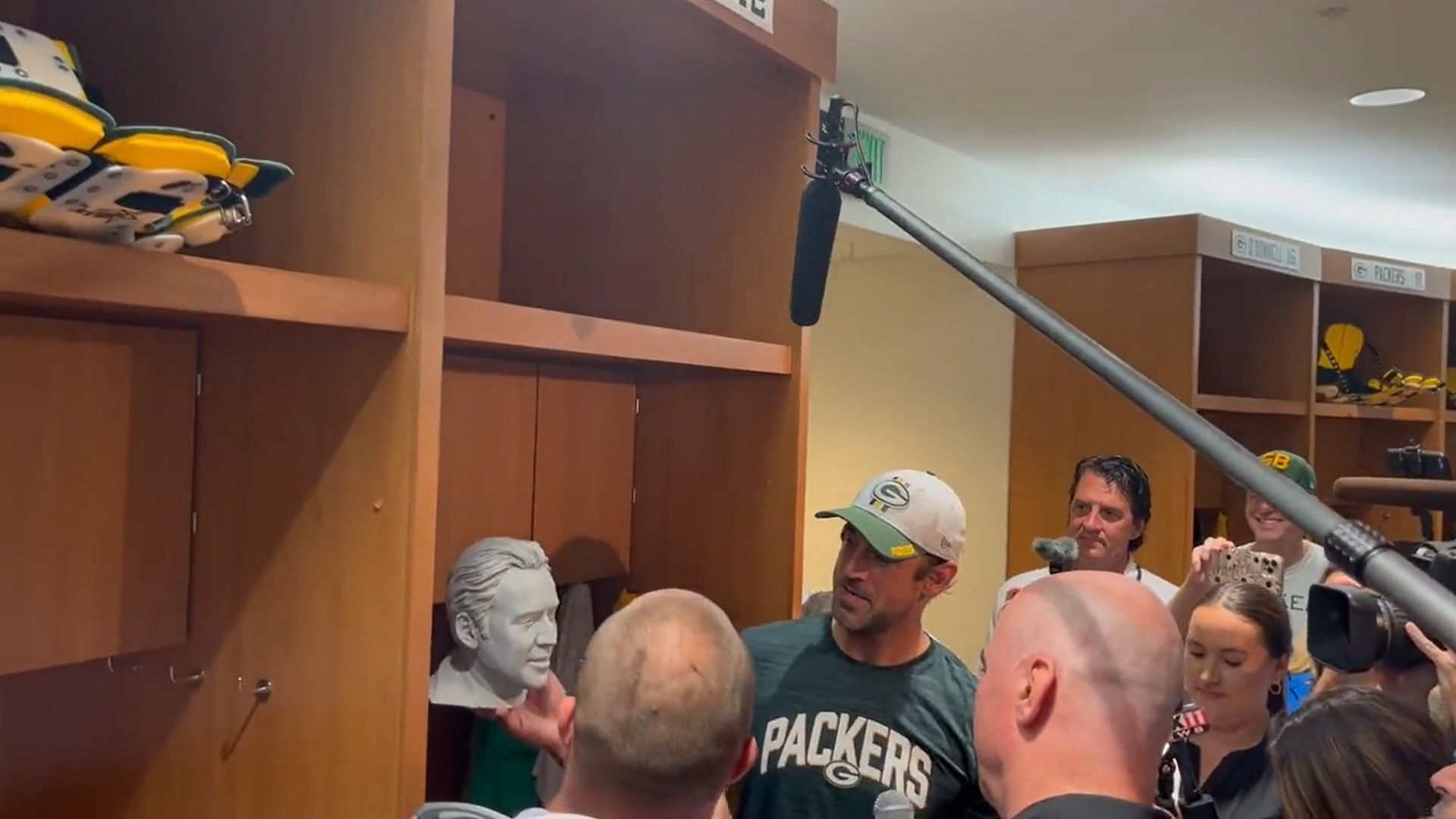 Aaron Rodgers with a Nicolas Cage bust in his locker