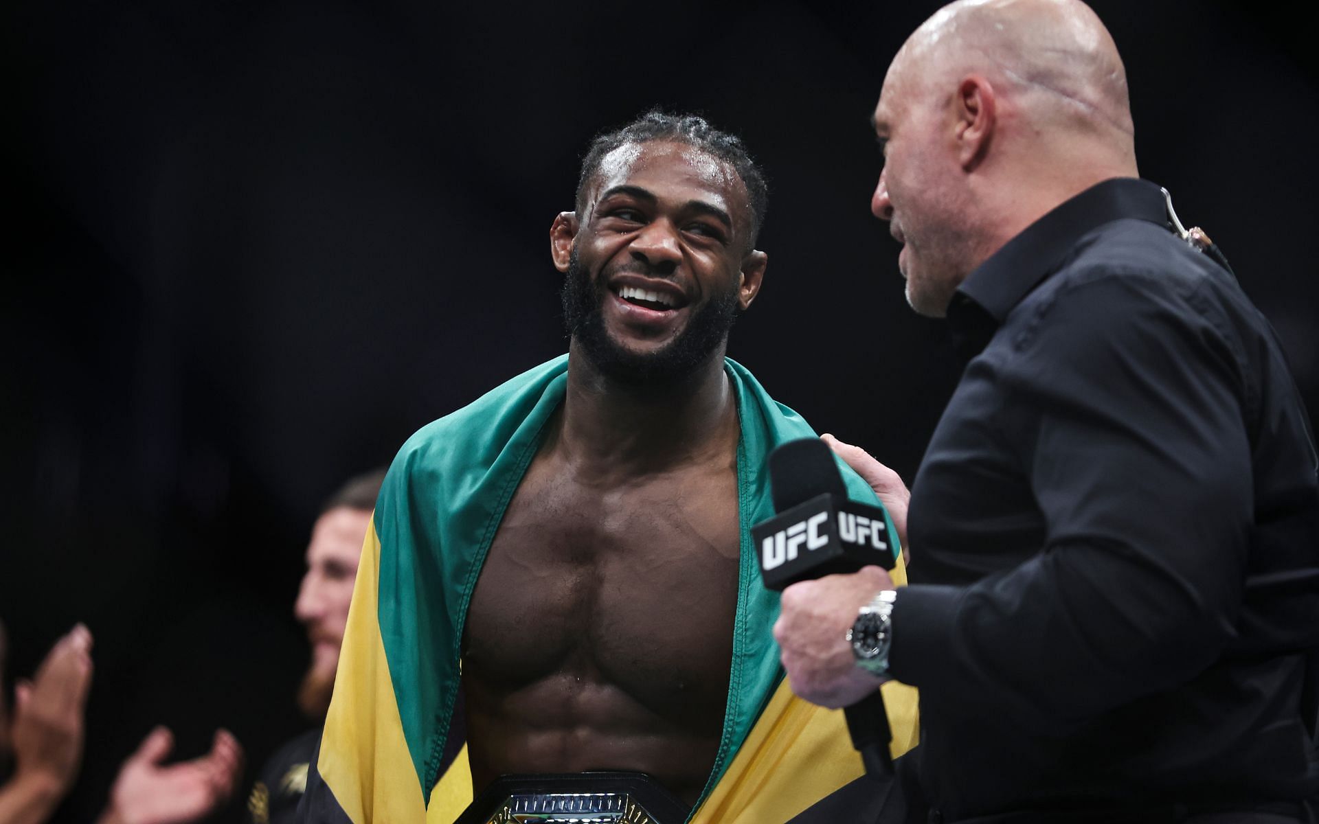 Aljamain Sterling with Joe Rogan after defending his bantamweight championship at UFC 273