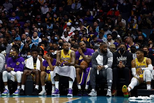 LA Lakers bench looks on at a game against Charlotte