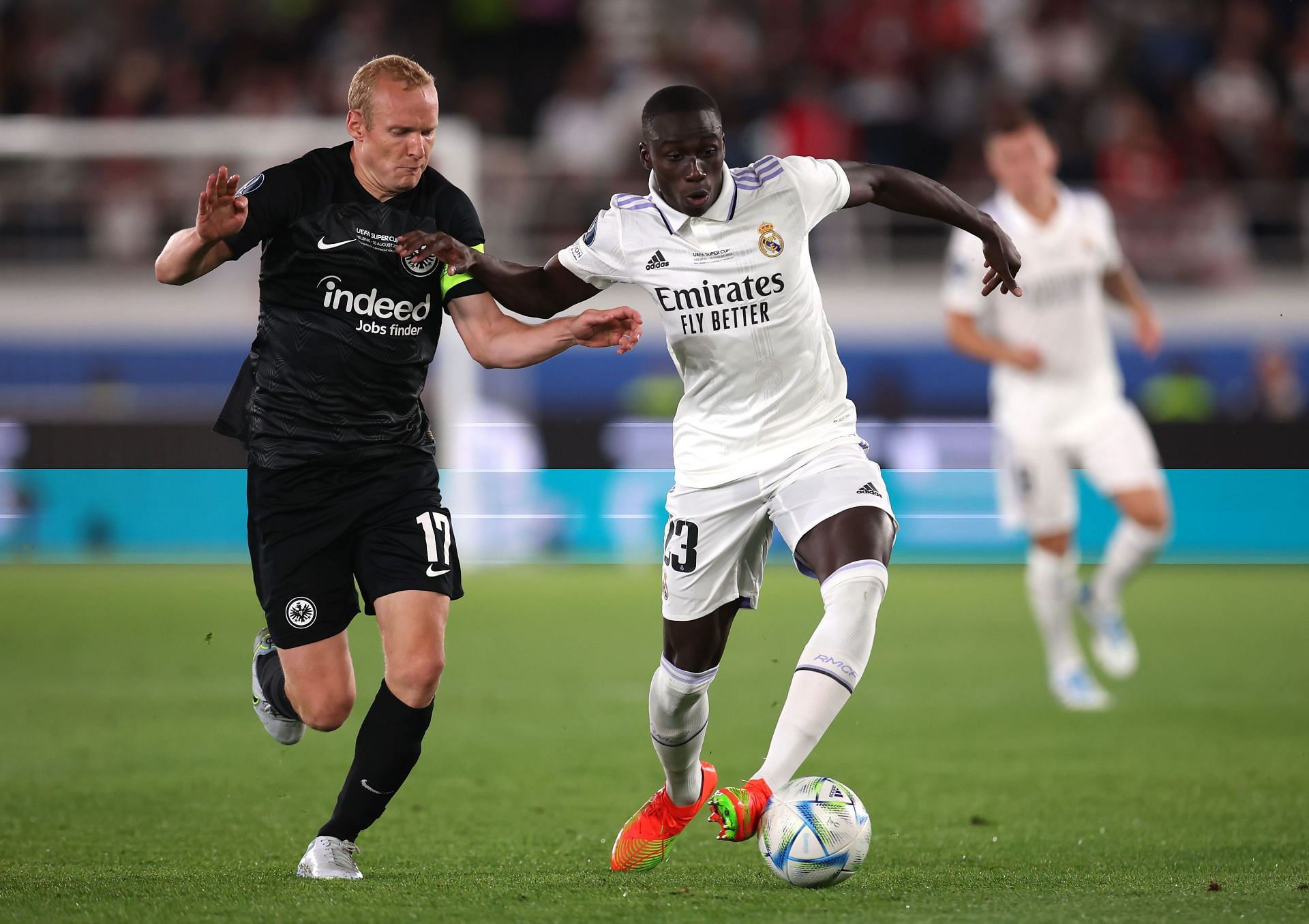 Sebastian Rode challenges Ferland Mendy during the Super Cup clash between Real Madrid and Eintracht Frankfurt.