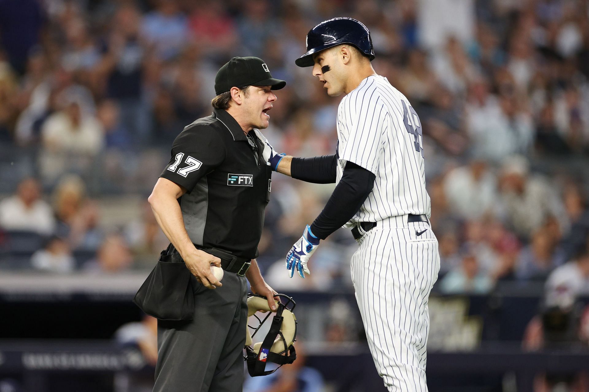 Anthony Rizzo argues with umpire DJ Reyburn over a call during the third inning at Yankee Stadium