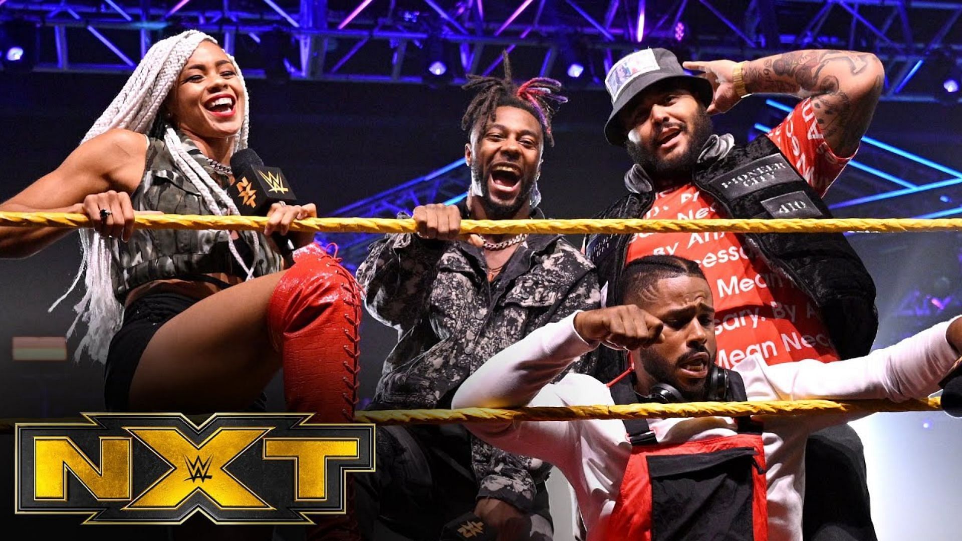 Former NXT faction Hit Row posing in the ring