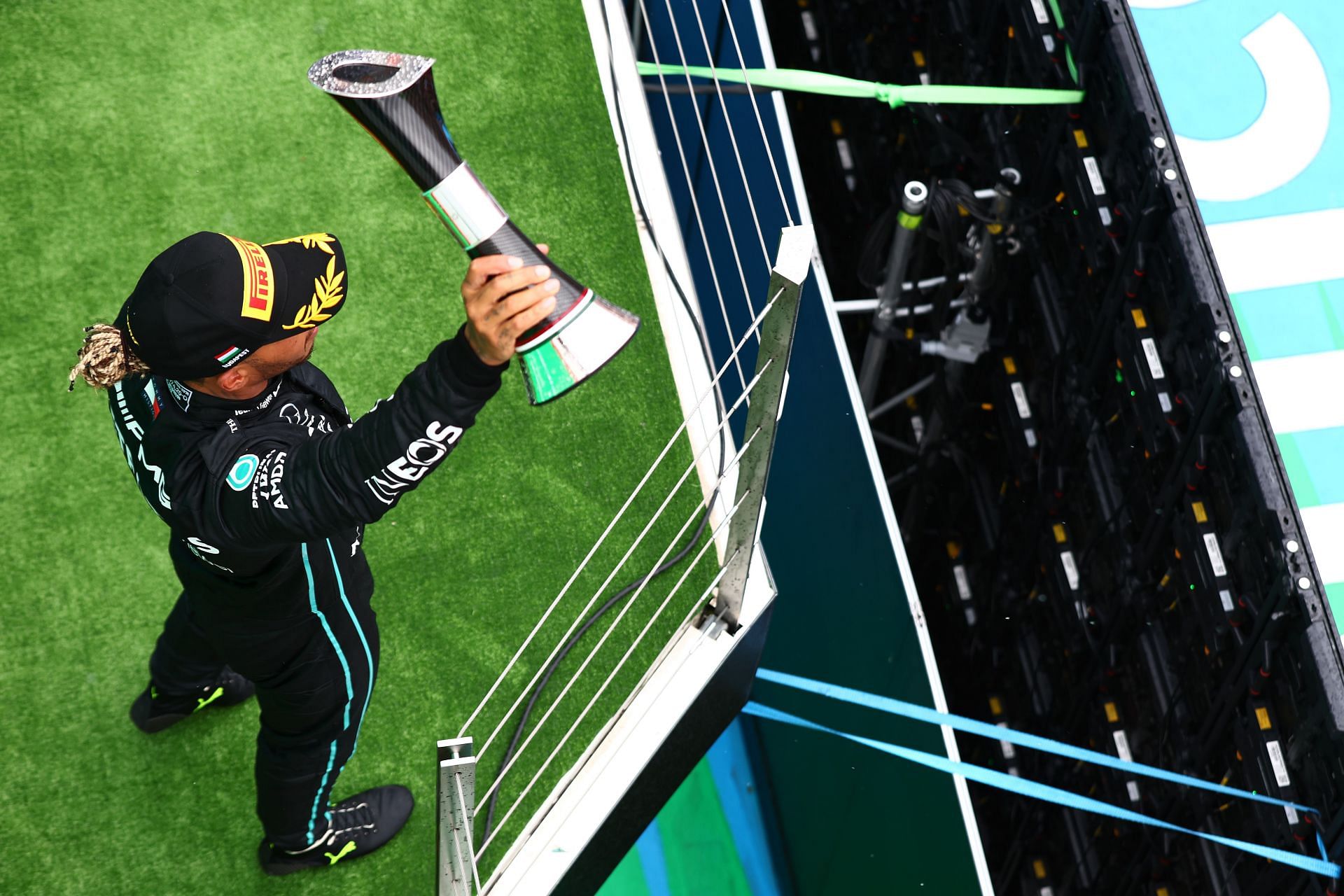 Mercedes driver Lewis hamilton holds aloft his P2 trophy on the podium at the 2022 F1 Hungarian GP. (Photo by Mark Thompson/Getty Images)