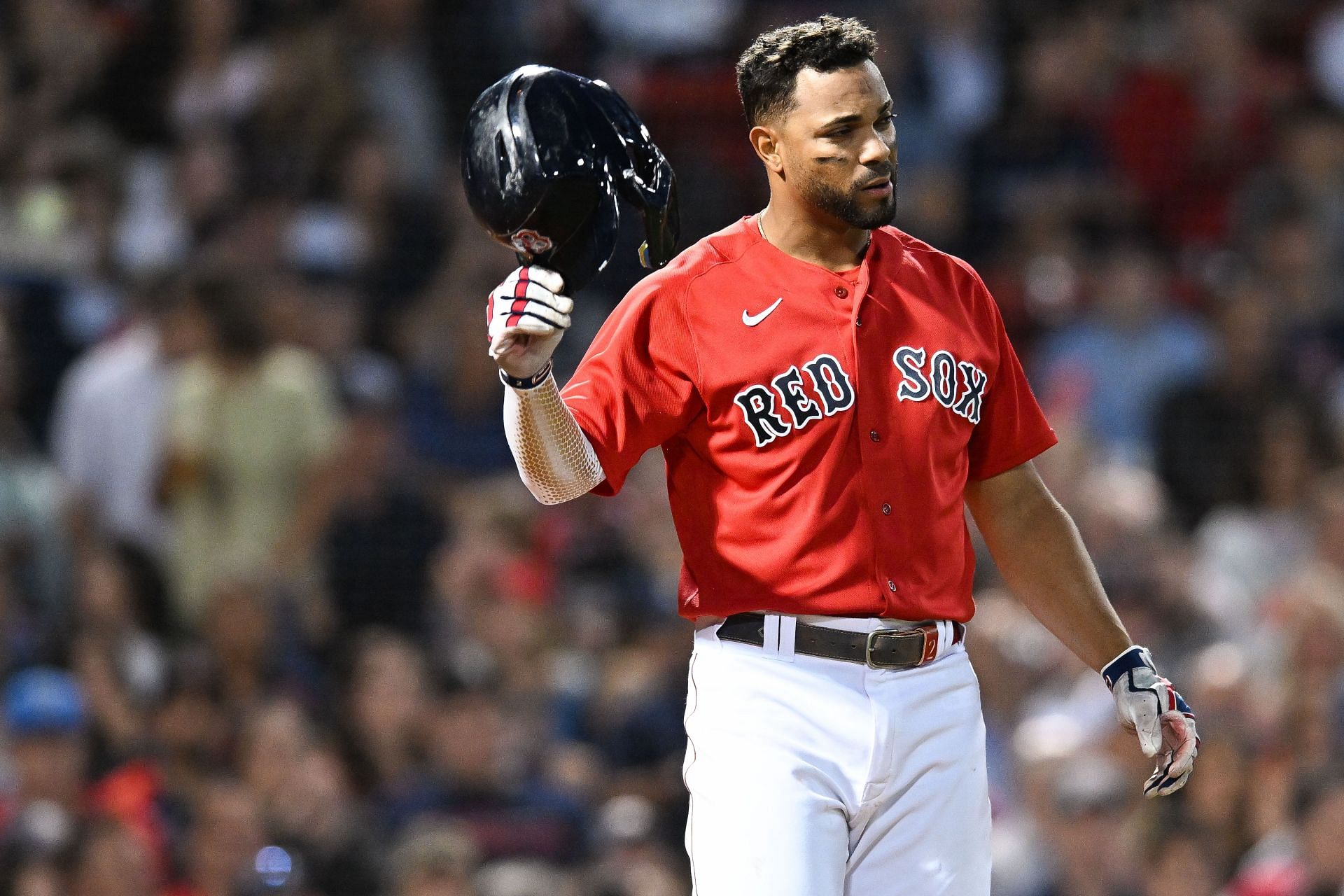 Xander Bogaerts slams his helment down in frustration after striking out during a MLB New York Yankees v Boston Red Sox game at Fenway Park.