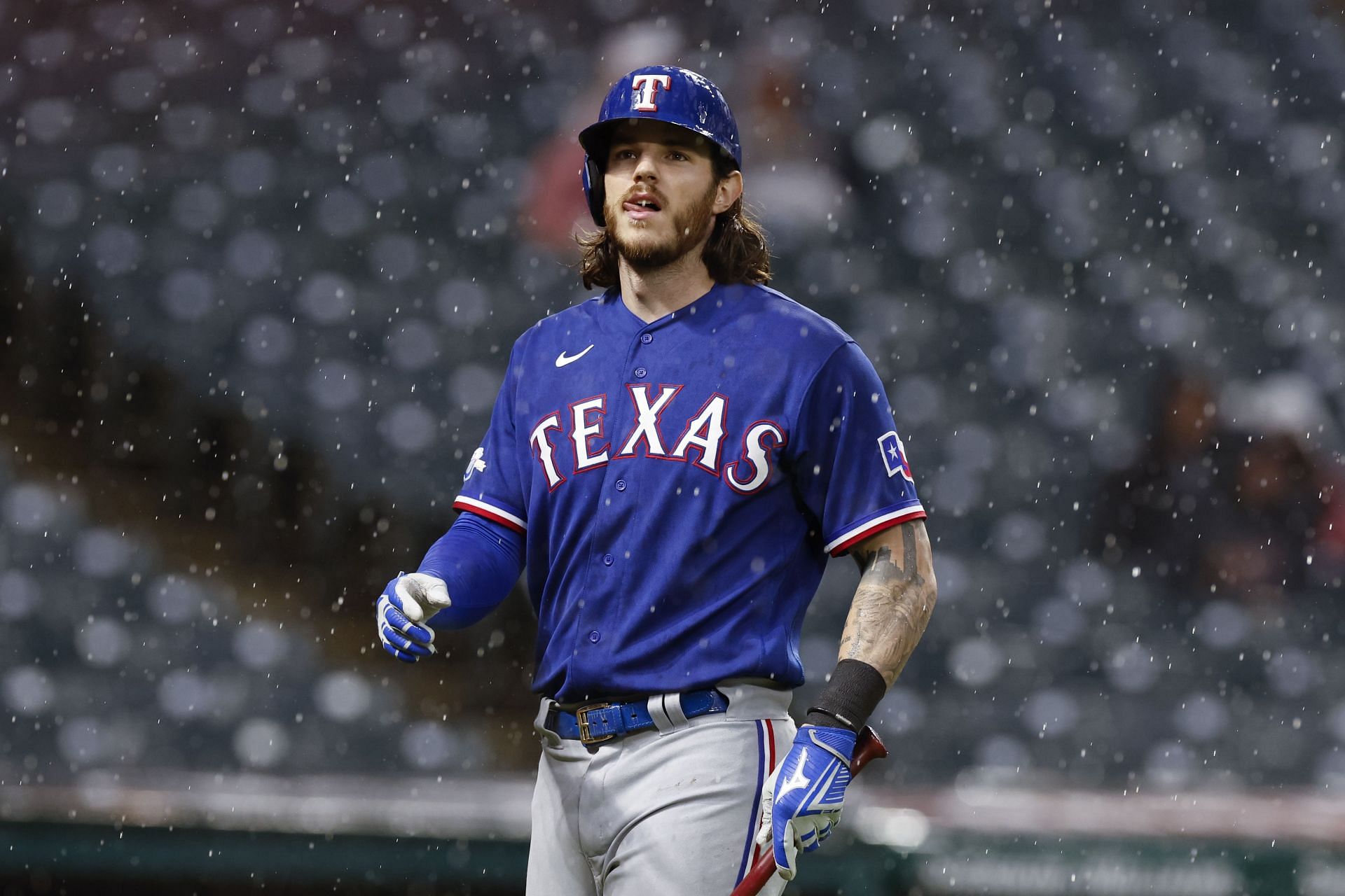 Jonah Heim of the Texas Rangers bats during a game against the Cleveland Guardians.