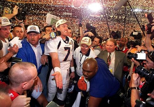 Elway celebrates victory in SB XXXIII