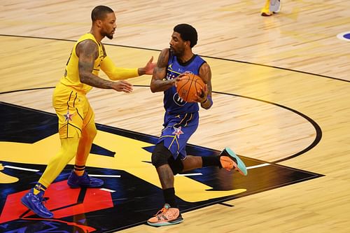 Damian Lillard guards Kyrie Irving during the 2021 NBA All-Star Game.