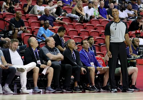 ESPN sports analyst and former NBA player Richard Jefferson (R) laughs as people in the front row, including owner James Dolan (L) and head coach Tom Thibodeau (3rd L) of the New York Knicks, talk to him as he officiates the second quarter of a game between the Knicks and the Portland Trail Blazers during the 2022 NBA Summer League at the Thomas & Mack Center on July 11, 2022 in Las Vegas, Nevada.