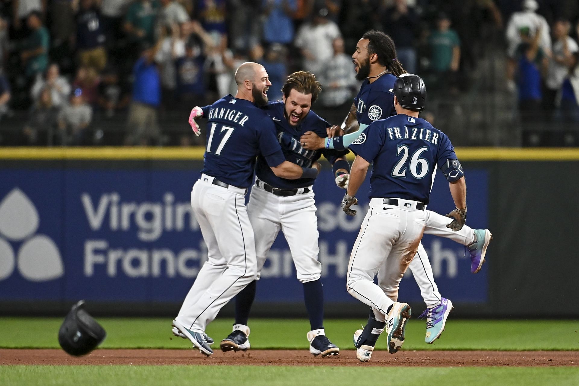 The Seattle Mariners celebrate their extra-inning victory over the New York Yankees.