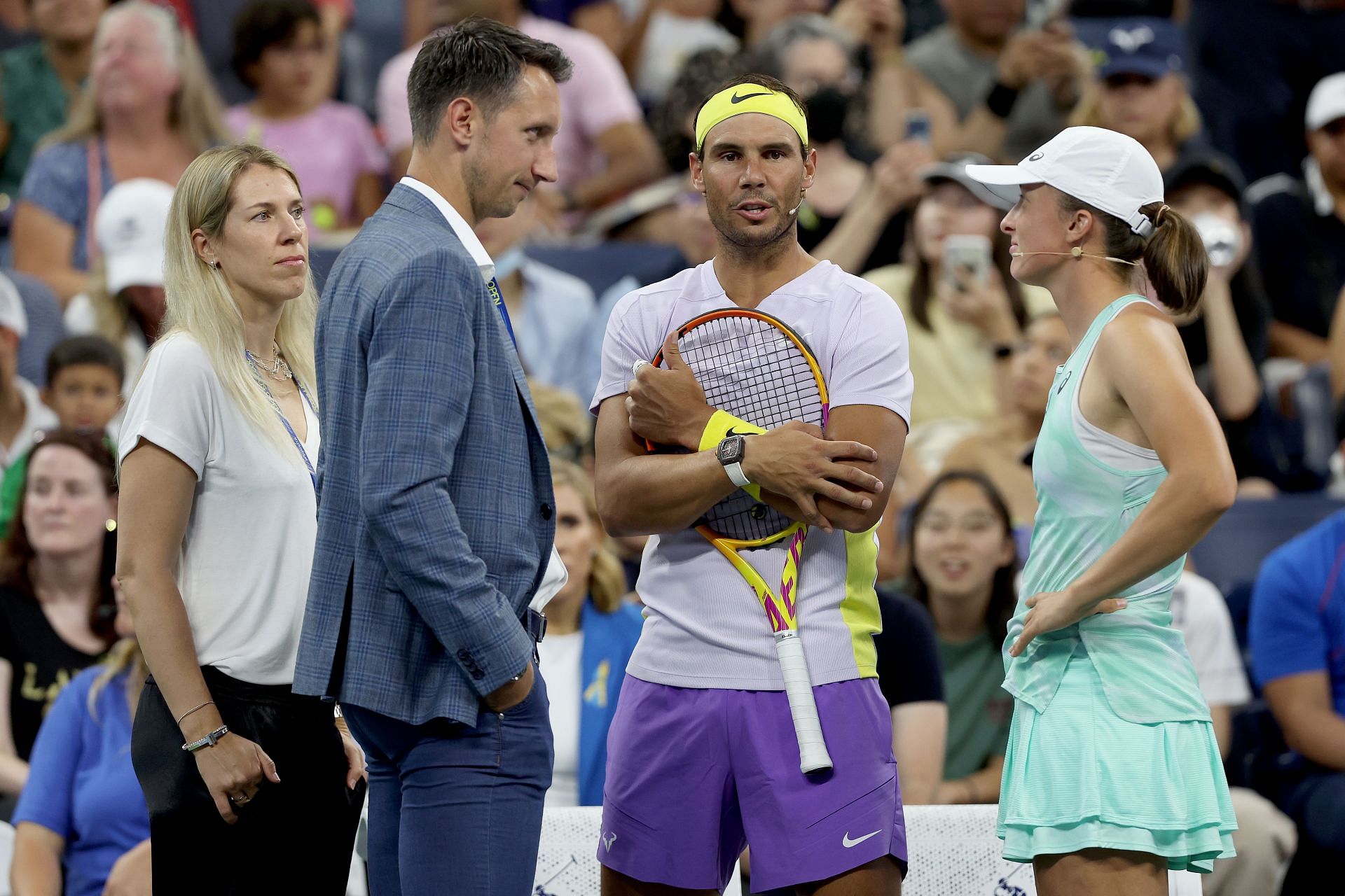 Rafael Nadal and Iga Swiatek speak with former players Olga Savchuk (leftmost) and Sergiy Stakhovsky (second from left) during the US Open's Tennis Plays for Peace charity event.