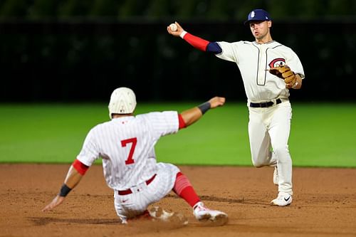 Nico Hoerner turns a double play at the MLB at Field of Dreams Game in Dyersville, Iowa.