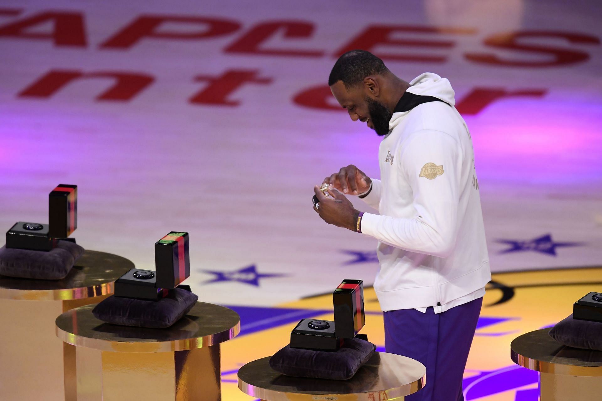 LeBron James #23 of the Los Angeles Lakers reacts as he receives his 2020 NBA championship ring