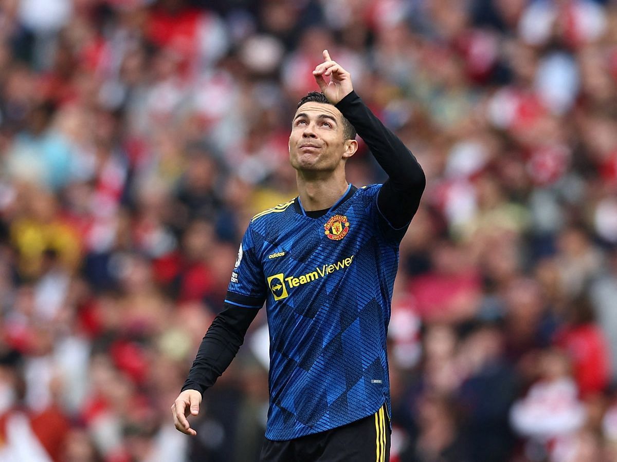 Cristiano Ronaldo points to the sky after scoring a goal against Arsenal (pic cred: The Mirror)