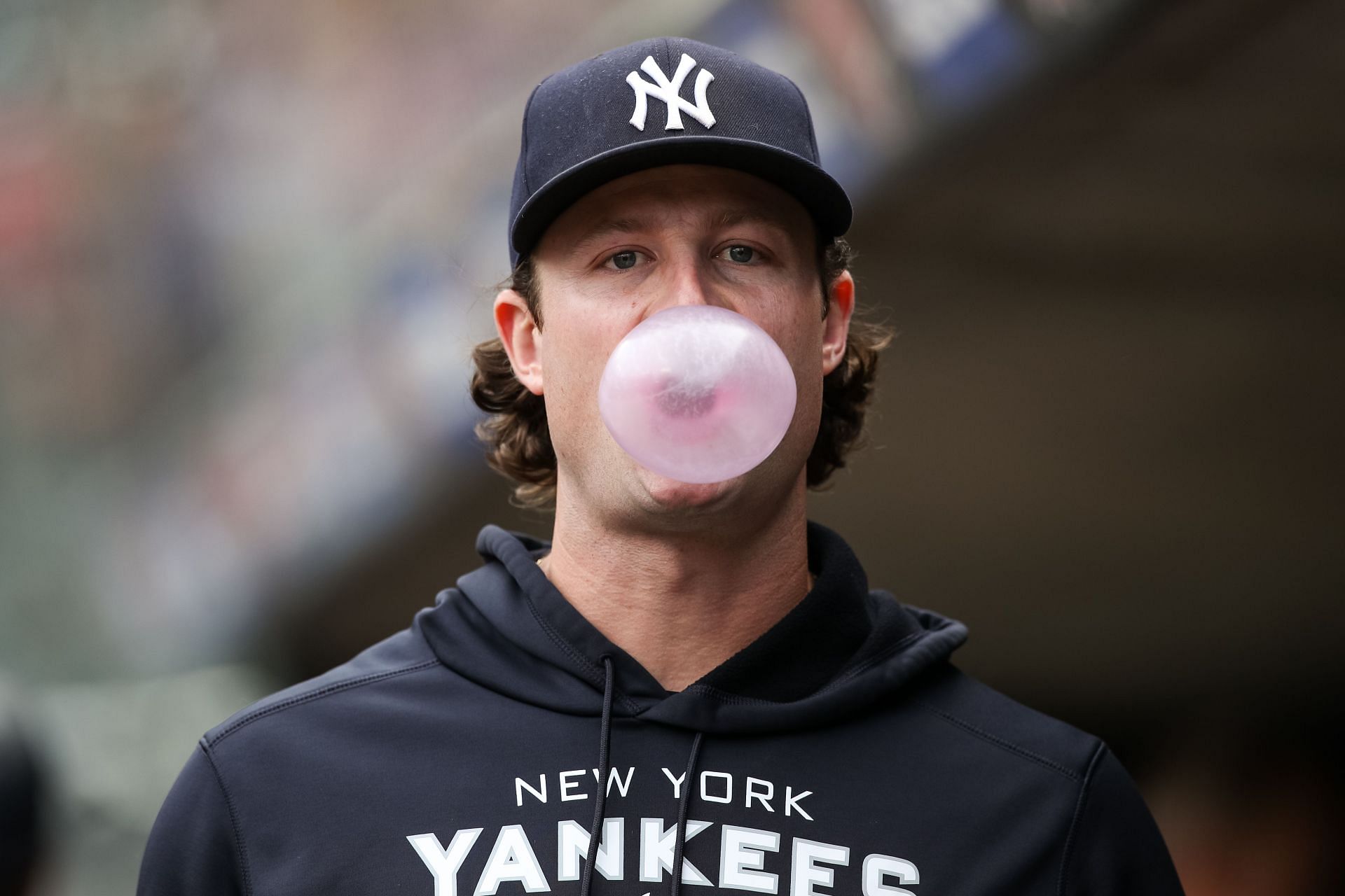 Gerrit Cole blows a bubble in the dugout before the start of the game against the Minnesota Twins.