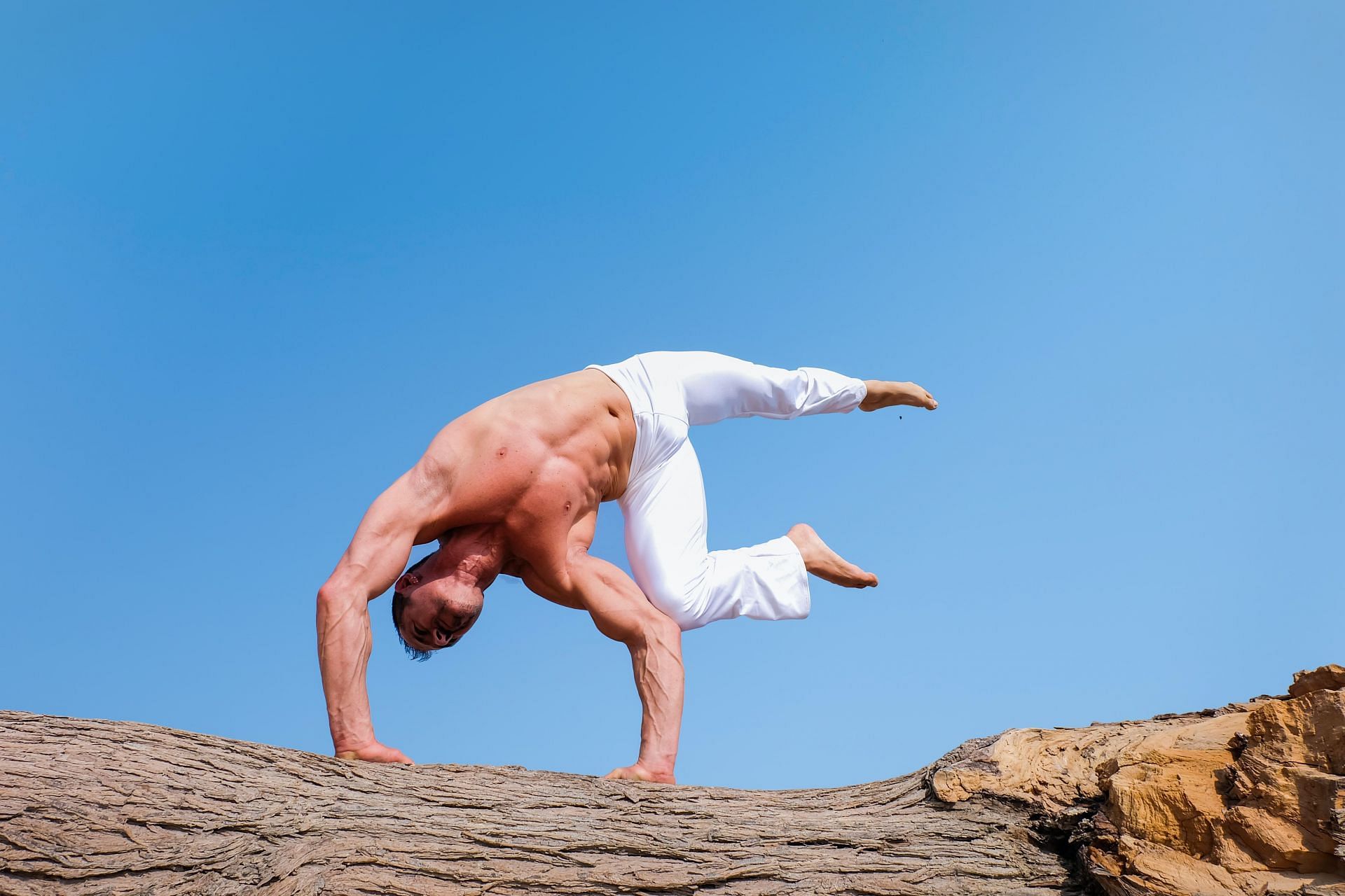 Tough yoga poses offer you a good challenge. (Image via Pexels @The Lazy Artist Gallery)